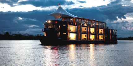 The Aria glowing as the sun sets on the Amazon River